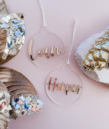 Frosted round bauble with cursive mirror name