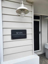 Matte black house address sign with stand-off mounts