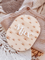 Oval baby announcement plaque with name - sun rays