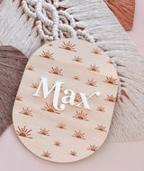 Oval baby announcement plaque with name - sun rays
