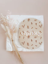 Oval baby announcement plaque with name - floral