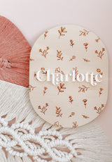 Oval baby announcement plaque with name - floral