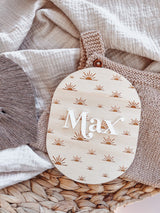 Oval baby announcement plaque with name - sun rays