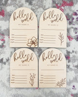 "Hello world" arch announcement plaque with magnolia flower