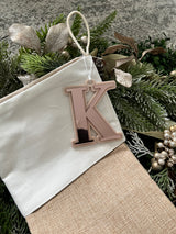 Natural burlap Christmas stocking with initial tag