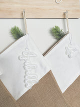 Natural burlap Christmas stocking with frosted name tag