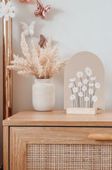 Arch plaque with printed daisy design