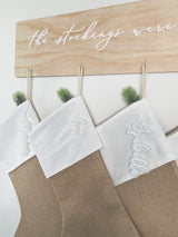 Natural burlap Christmas stocking with frosted name tag