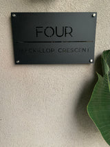 Matte black house address sign with stand-off mounts