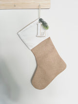 Natural burlap Christmas stocking with initial tag