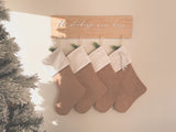 Natural burlap Christmas stocking with frosted name tag